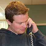 Photo of Circulation staff member answering the phone