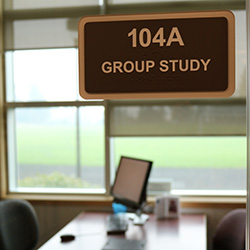 Photo of a group study room on the first floor of Barber Library