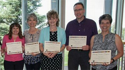 Photo of COCC employees receiving an award